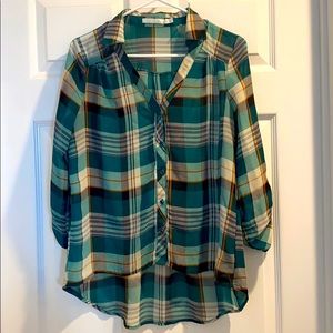 Boutique women’s flannel pattern shirt.